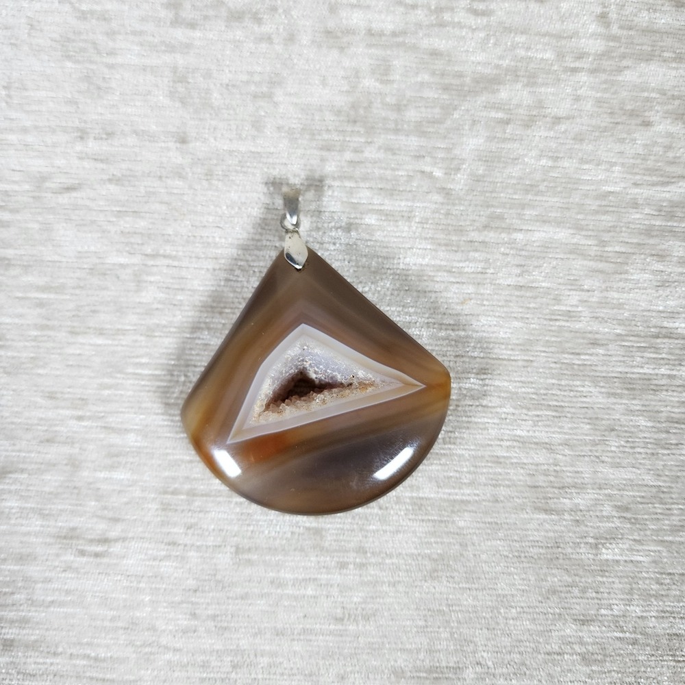 polished brown agate pendant with a sparkling triangular druzy center 2.75"